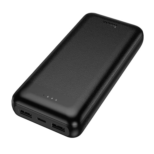 A black portable power bank with a textured leather-like finish, showing four USB-C ports on one end and a small LED battery indicator on the other, photographed on a solid white background.