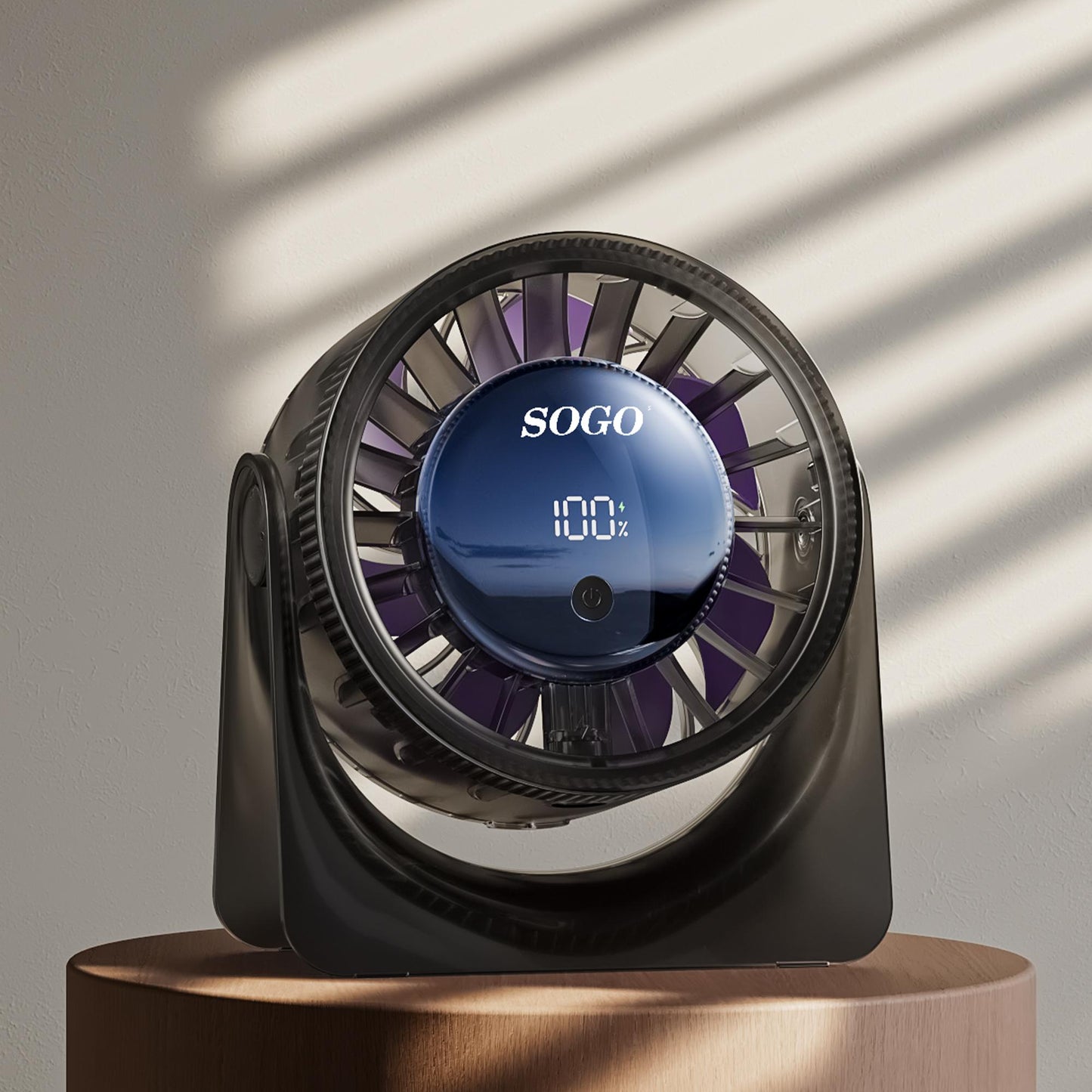 Sogo fan on a wooden stand with a neutral background