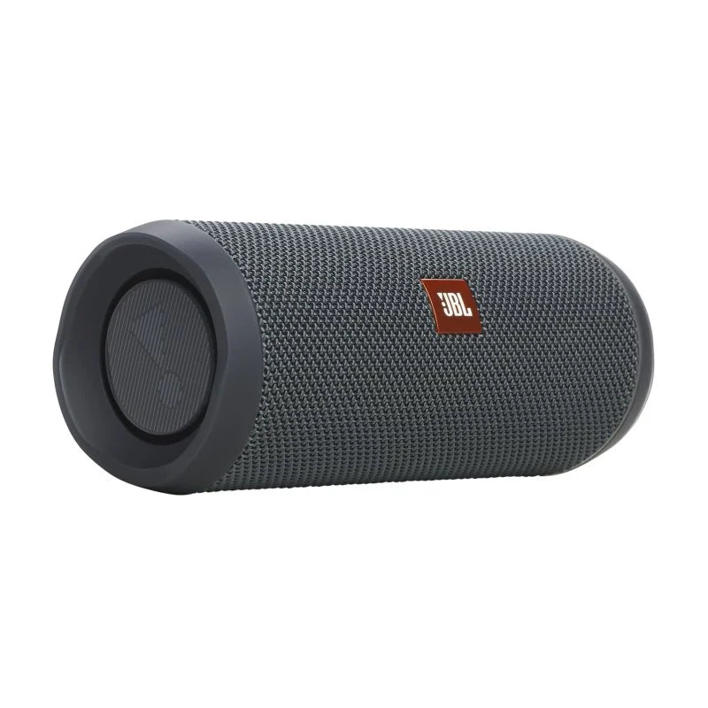 A dark gray JBL portable Bluetooth speaker with a textured fabric grille and a small red JBL logo patch, shown on a plain white background.