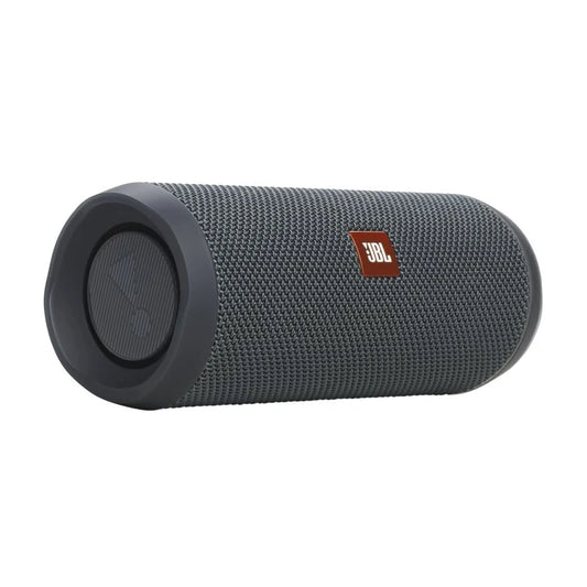 A dark gray JBL portable Bluetooth speaker with a textured fabric grille and a small red JBL logo patch, shown on a plain white background.