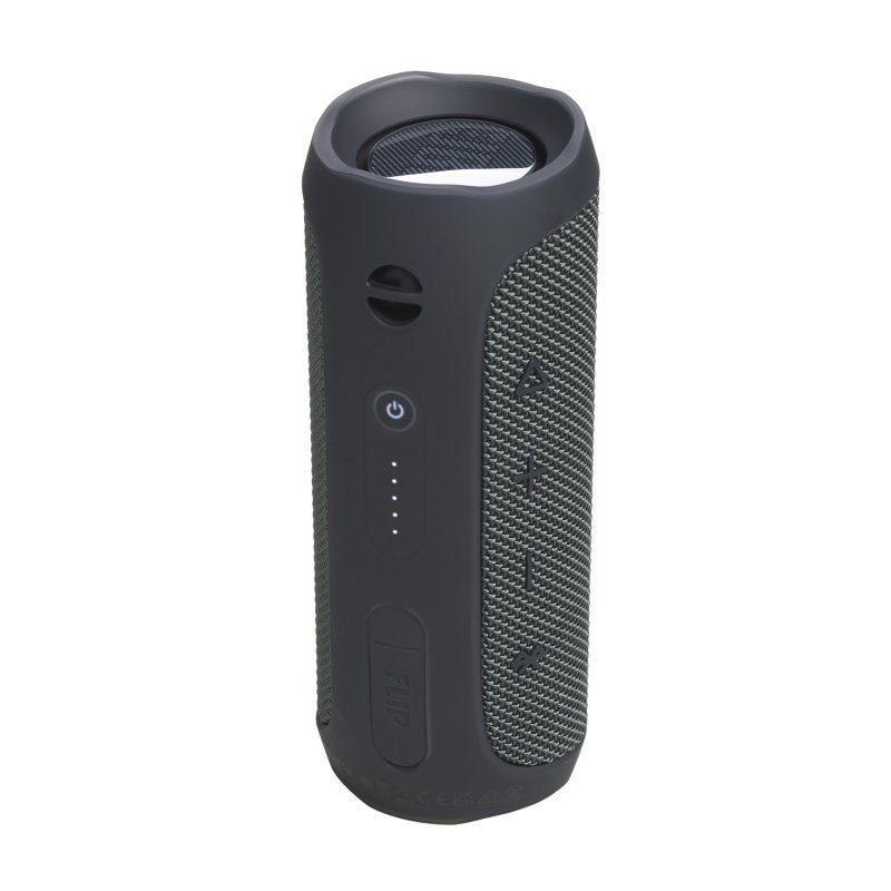 A dark gray portable Bluetooth speaker with a textured side panel and a power button, shown on a plain white background.