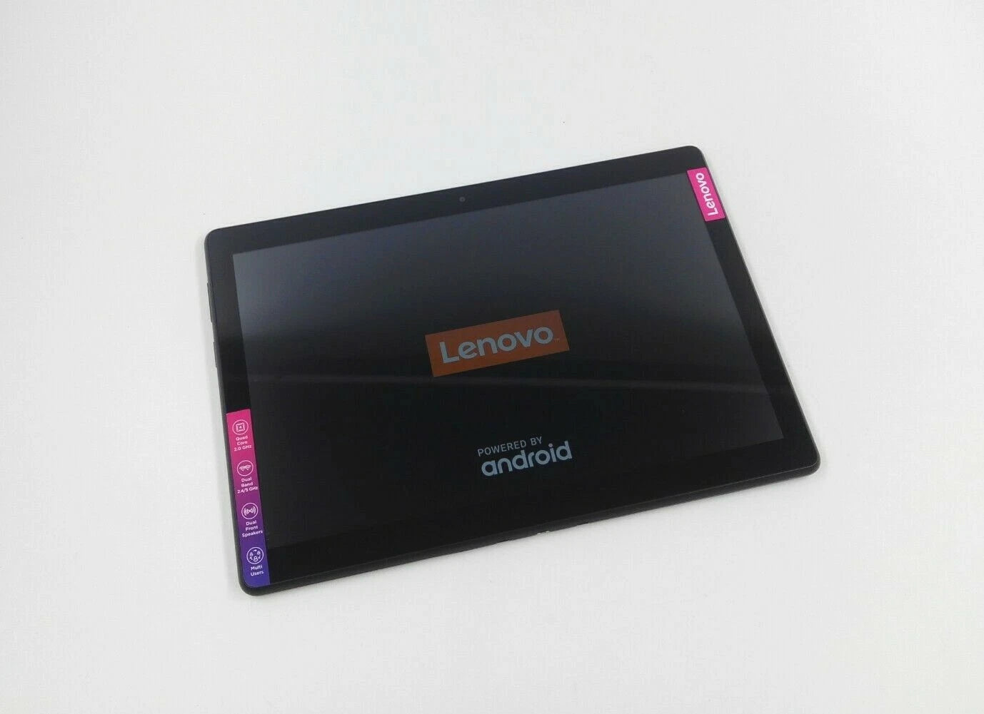 A Lenovo tablet with a black bezel and screen, featuring pink Lenovo stickers on the top-right and bottom-left corners, displayed on a clean white background.